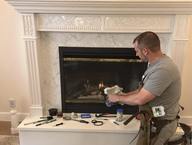 Coventry Chimney Sweep performing fireplace maintenance in Coventry, CT