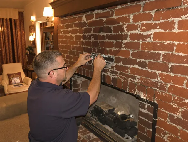 Coventry Chimney Sweep expert fixing a fireplace in Coventry, CT